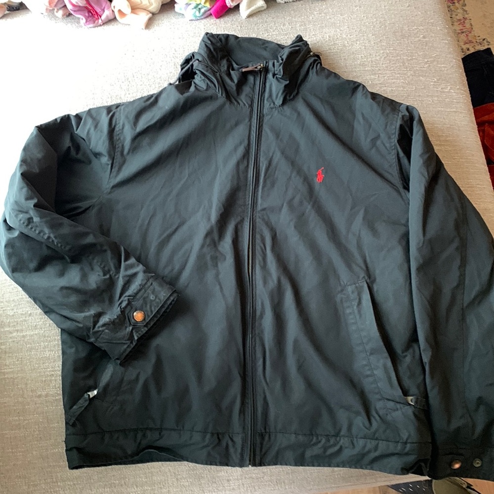 Fleece lined jacket with hood that can zip in or out.